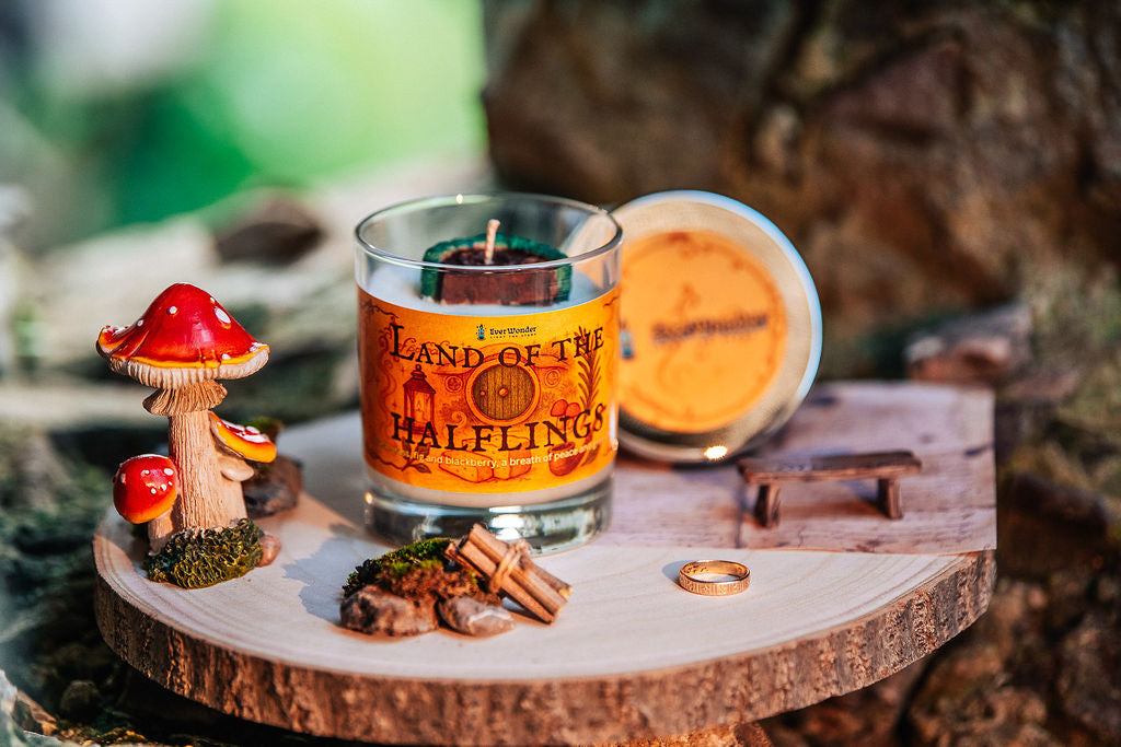 Cottagecore fantasy candle styled with woodland mushrooms moss and natural props