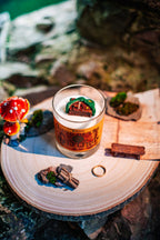 Land of the Halflings candle photographed outdoors with fantasy countryside scenery